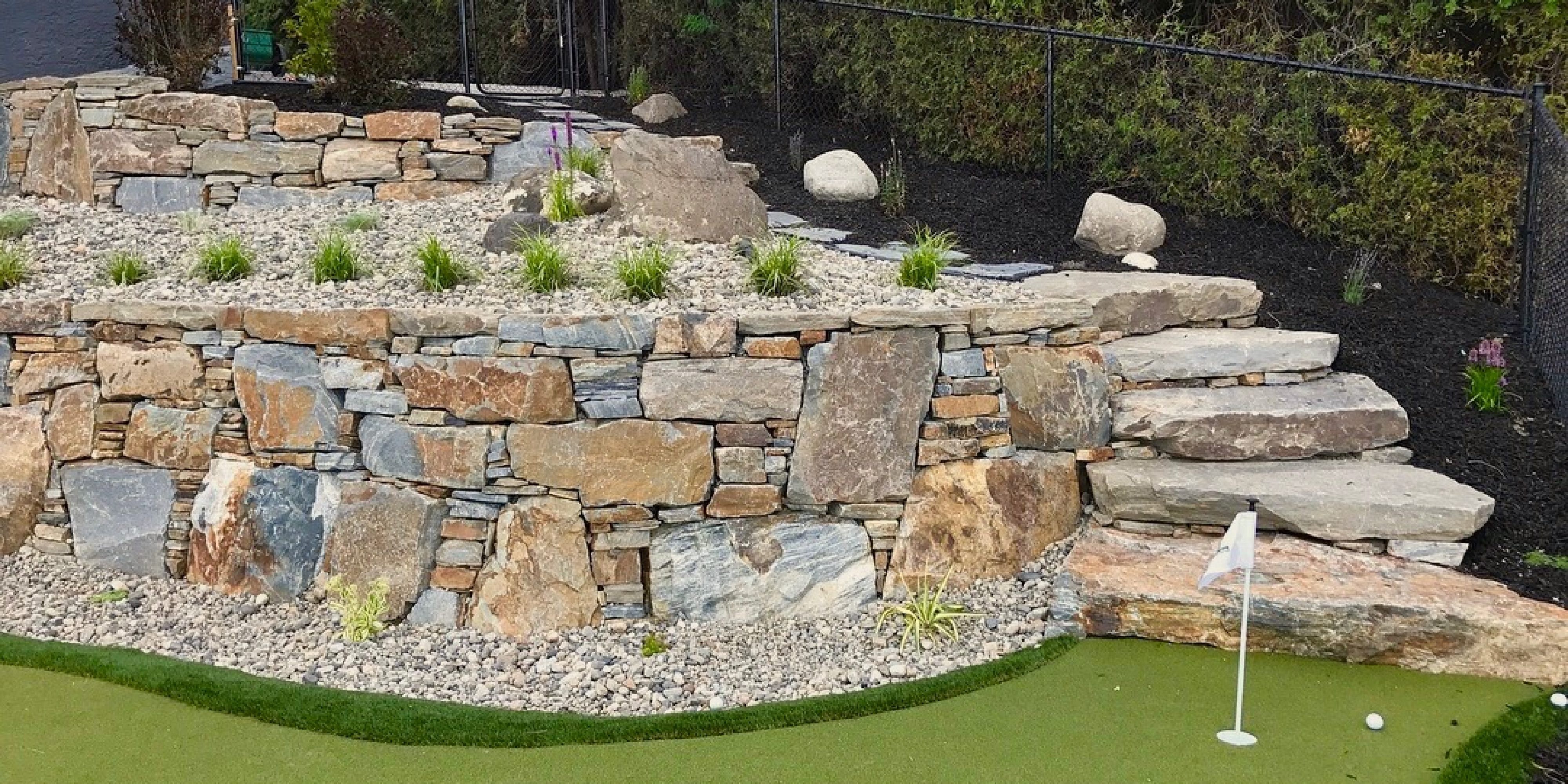 golf course and rock wall